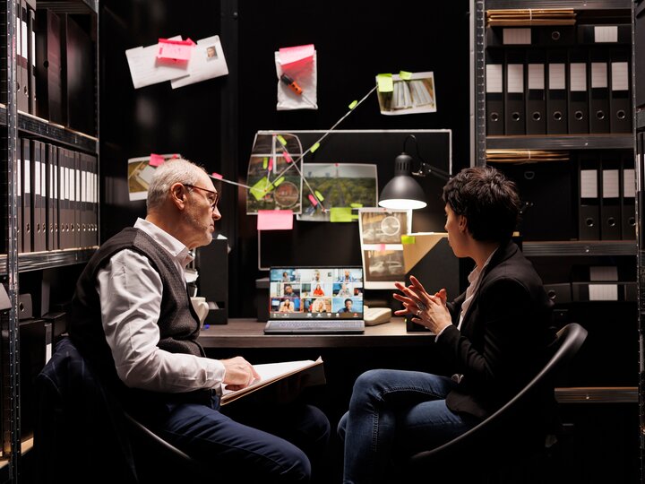 two people in an evidence room