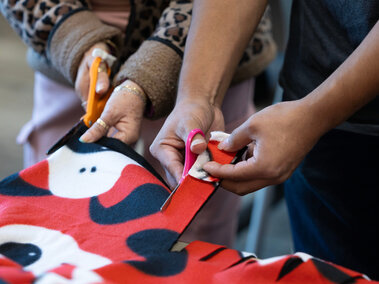 Intercultural senior center cutting fabric